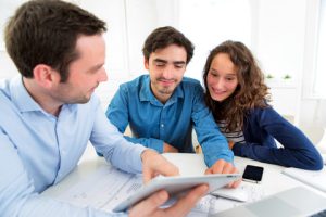 Young couple with estate agents