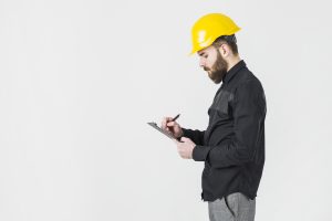A man filling in building survey