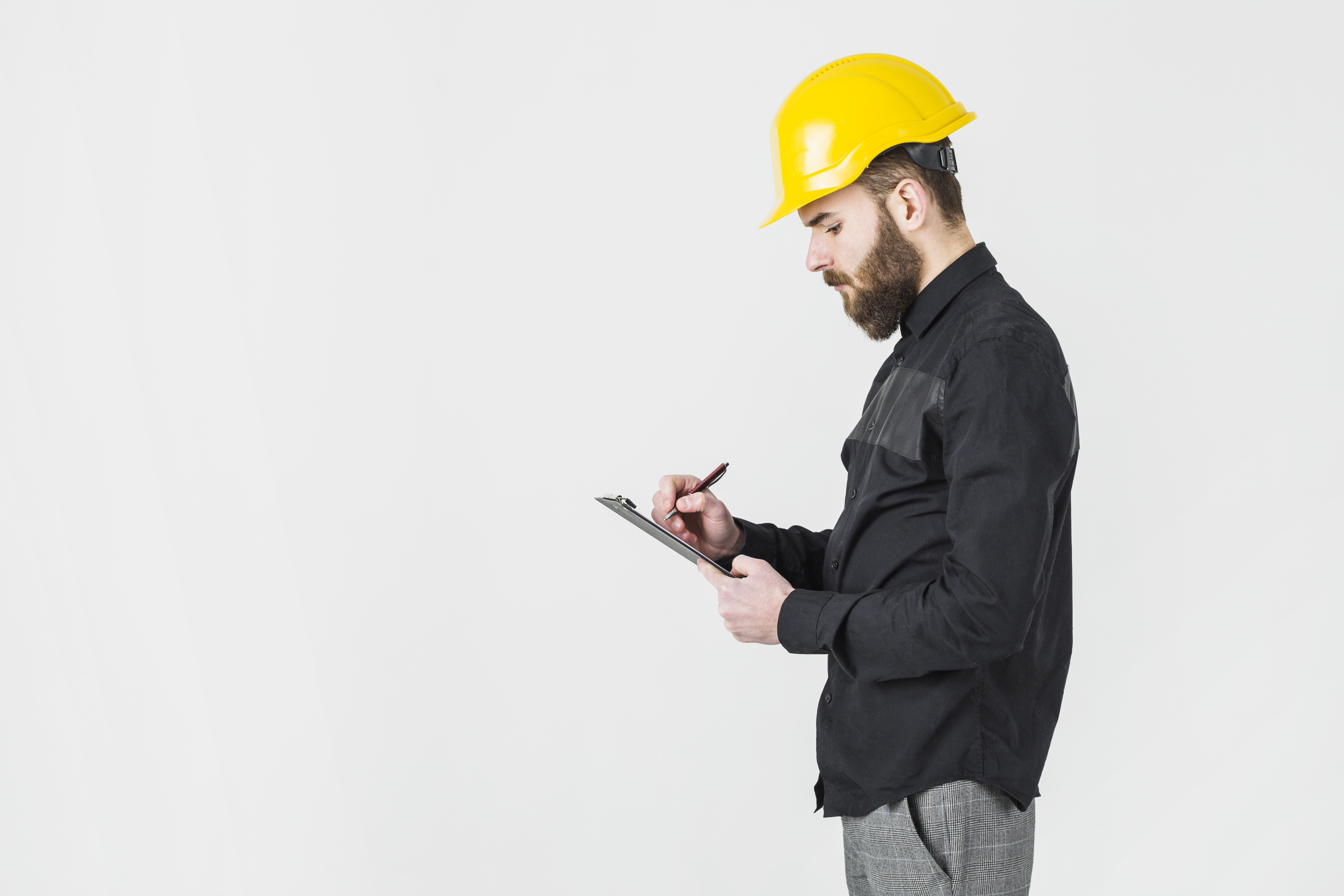 A man filling in building survey